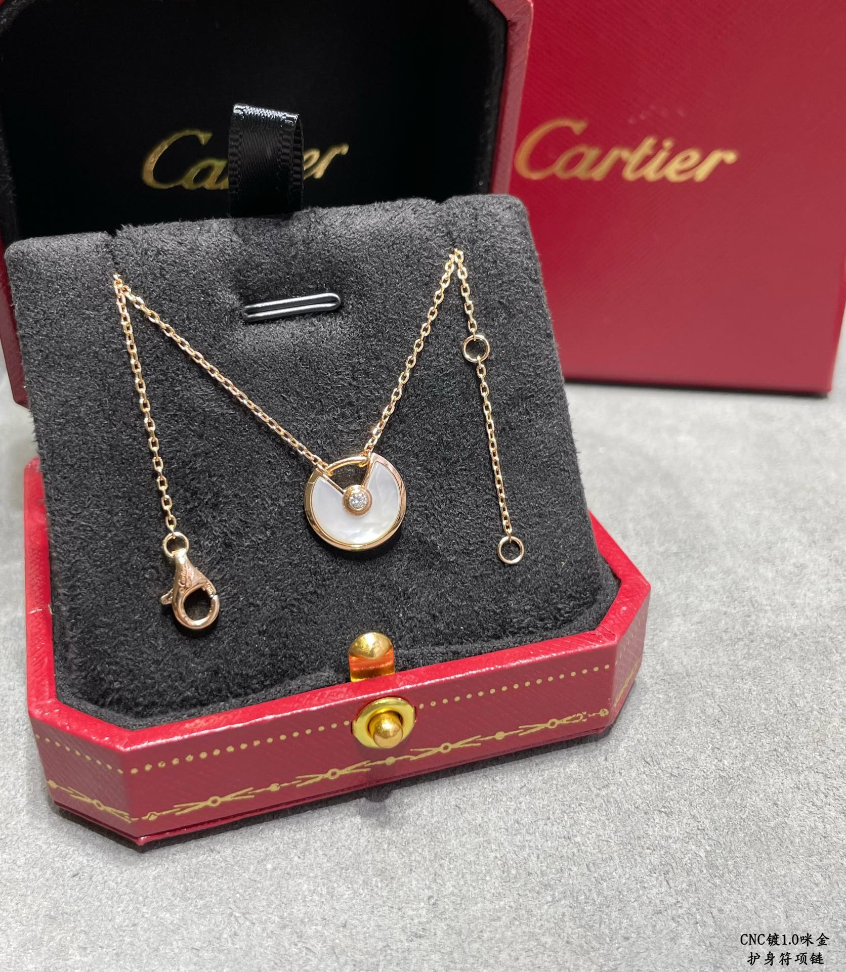 Ca*t*er amulet necklace
