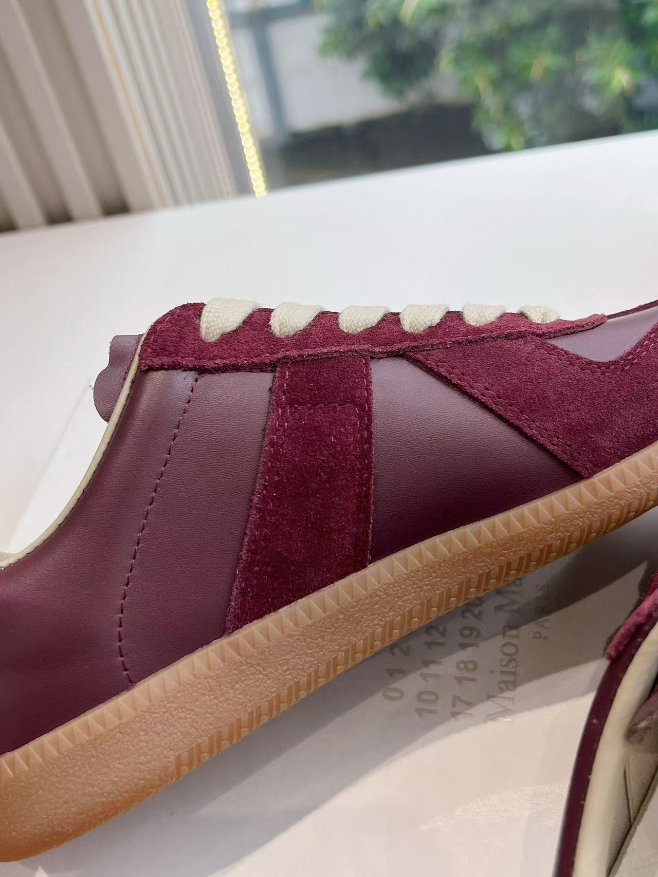 ua ma*s*n Ma*i*la mm6 sneakers