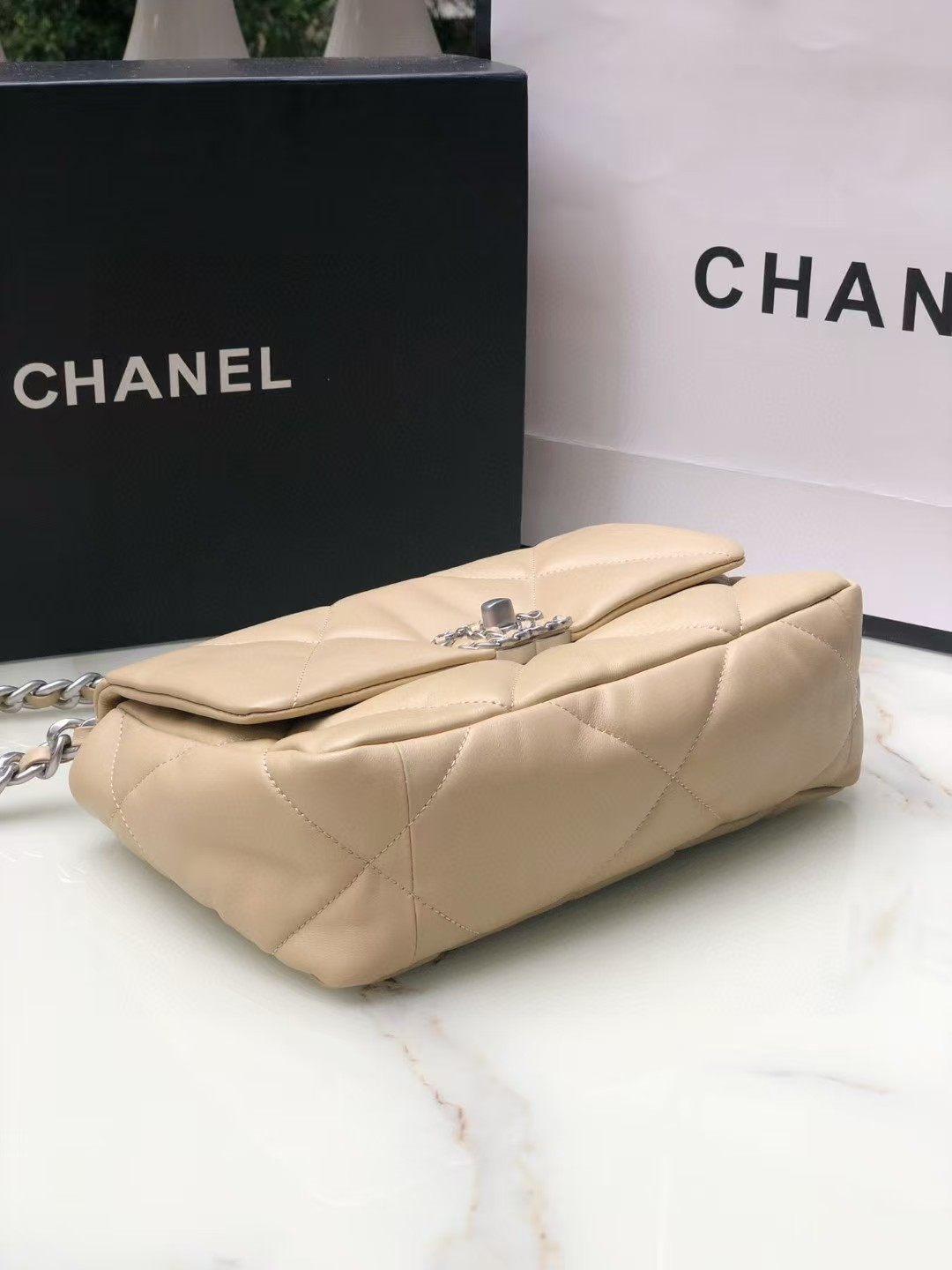 Ch*el 19 handbag shiny leather, gold-tone, silver-tone & ruthenium-finish metal beige 26x16x9cm