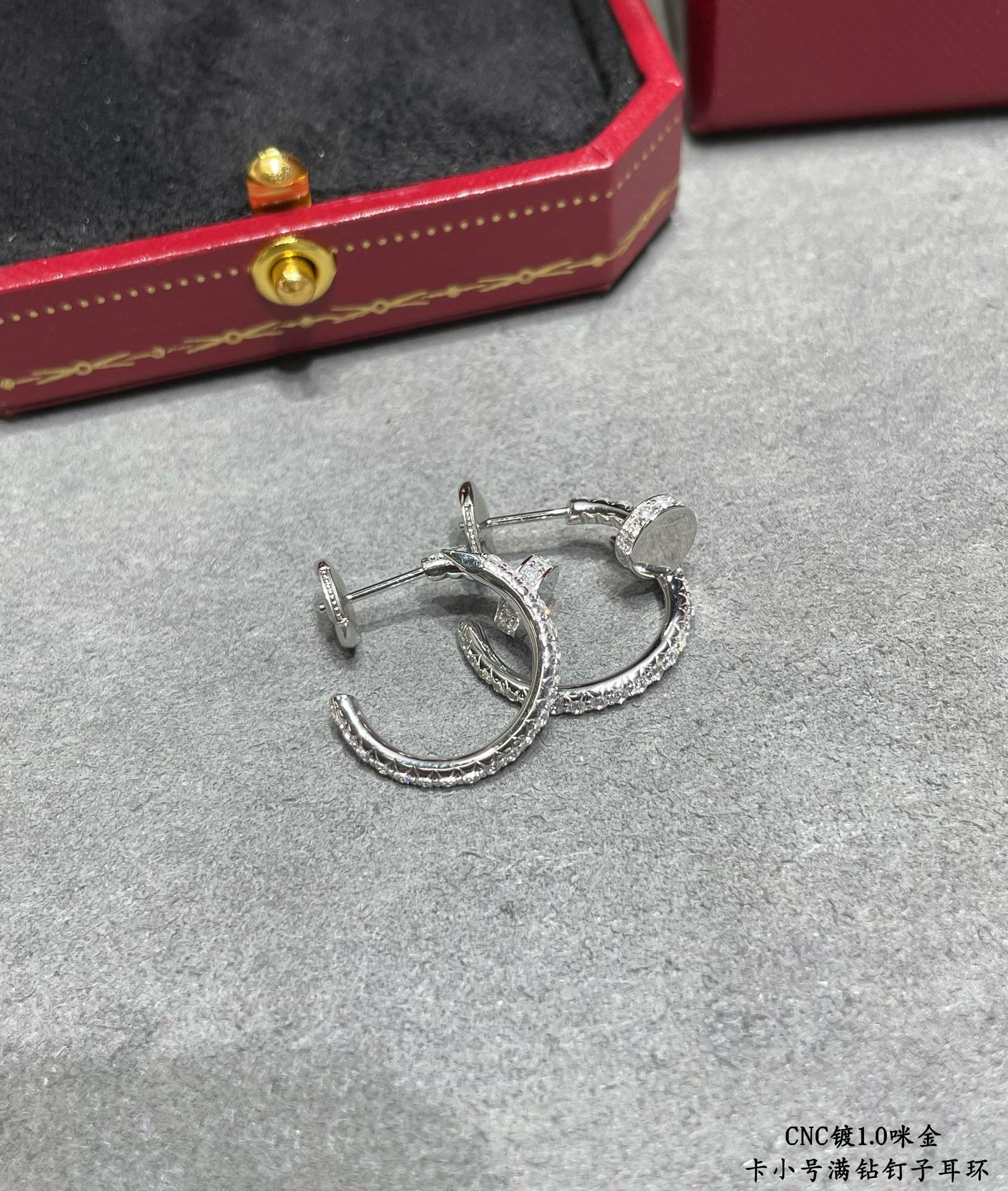 ca*t*er fully Di*m*nd-encrusted small nail earrings