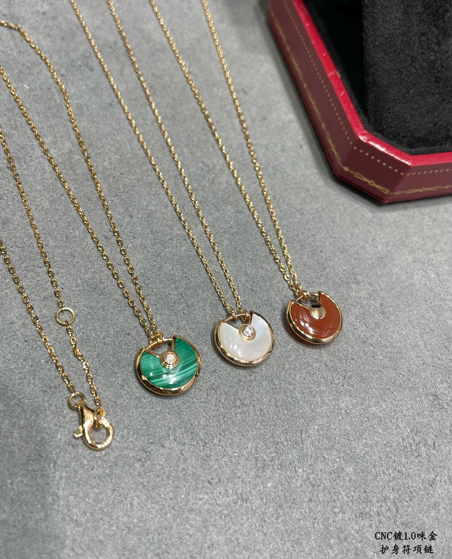 Ca*t*er amulet necklace