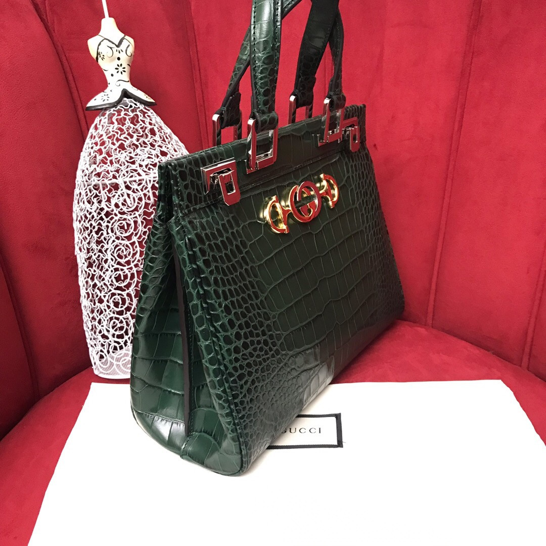 G*u*i zumi leather medium top handle bag