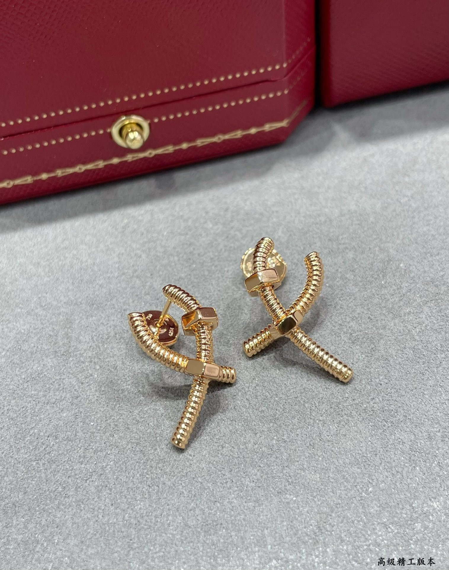 Ca*t*er cross screw earrings