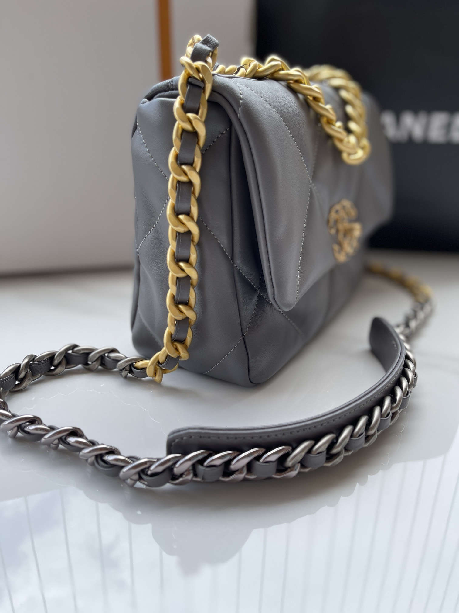 Ch*el 19 handbag shiny leather, gold-tone, silver-tone & ruthenium-finish metal dark gray 6.2 × 10.1 × 3.5 in