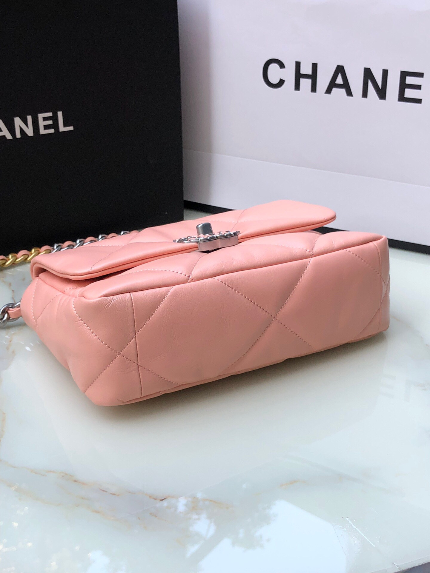Ch*el 19 handbag shiny leather, gold-tone, silver-tone & ruthenium-finish metal light pink 6.2 × 10.1 × 3.5 in