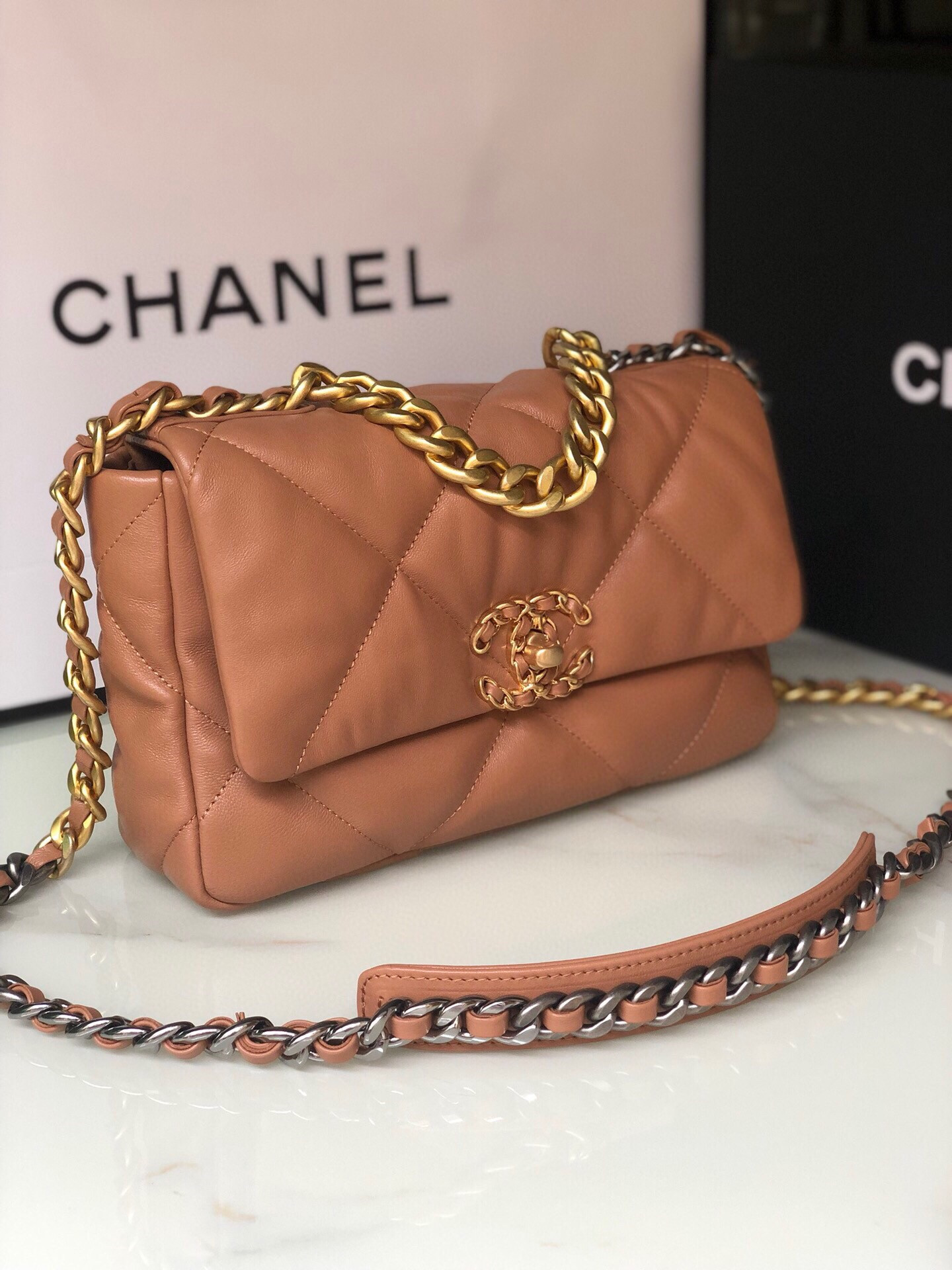 Ch*el 19 handbag shiny leather, gold-tone, silver-tone & ruthenium-finish metal caramel 6.2 × 10.1 × 3.5 in