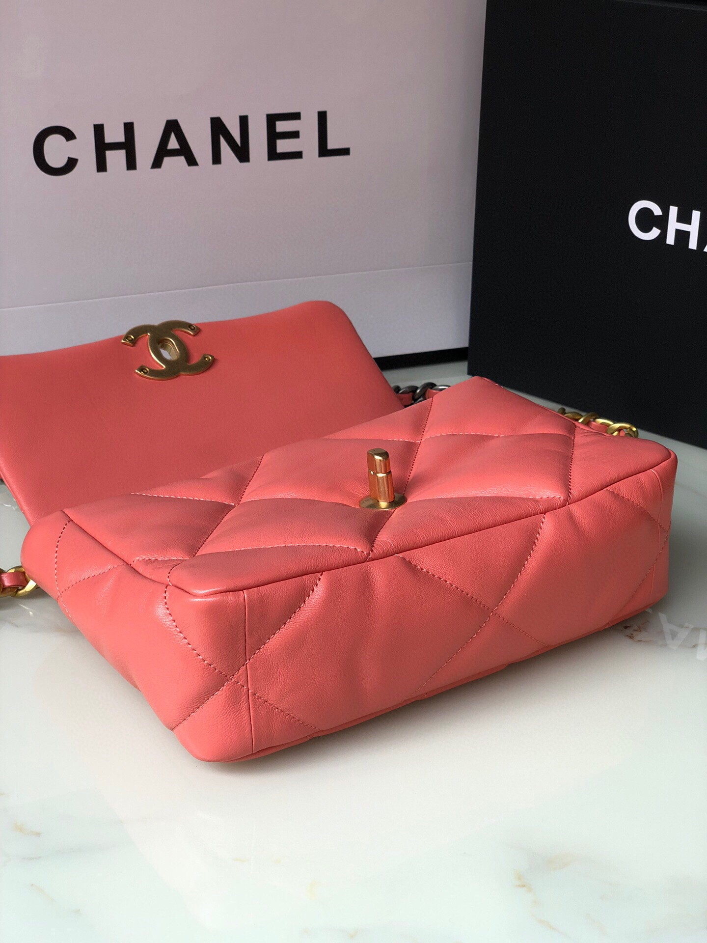 Ch*el 19 handbag shiny pink gold-tone, silver-tone & ruthenium-finish metal 6.2 × 10.1 × 3.5 in