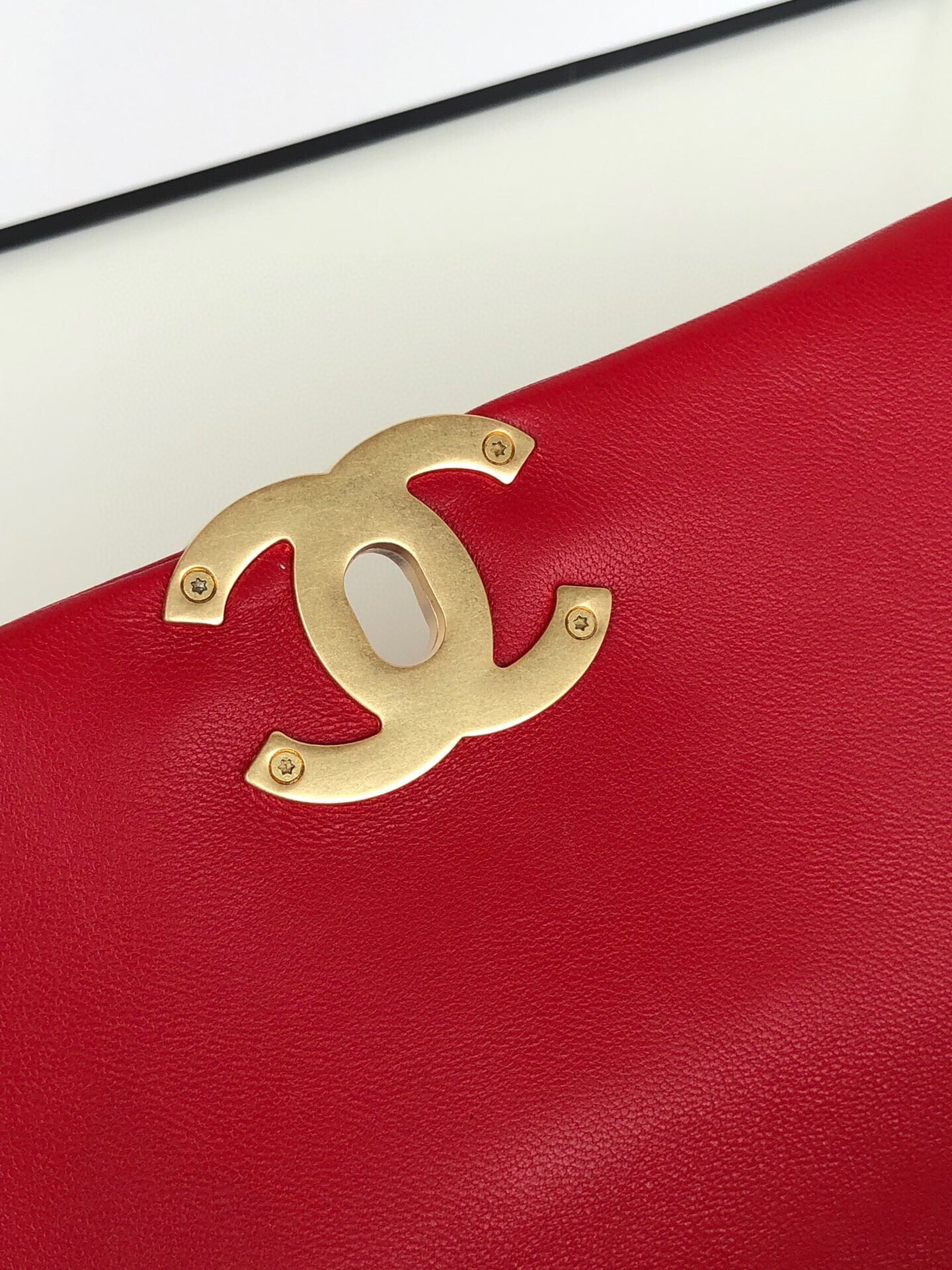 Ch*el 19 handbag shiny leather, gold-tone, silver-tone & ruthenium-finish metal red 6.2 × 10.1 × 3.5 in