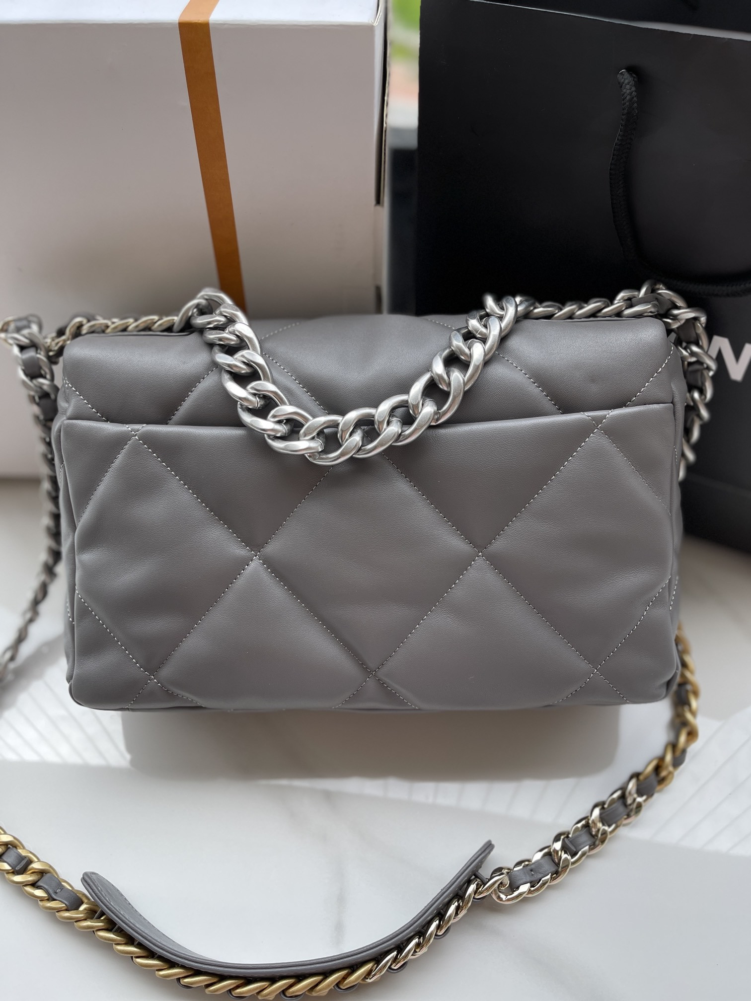 Ch*el 19 large handbag shiny leather, gold-tone, silver-tone & ruthenium-finish metal gray 7.8 × 11.7 × 3.9 in