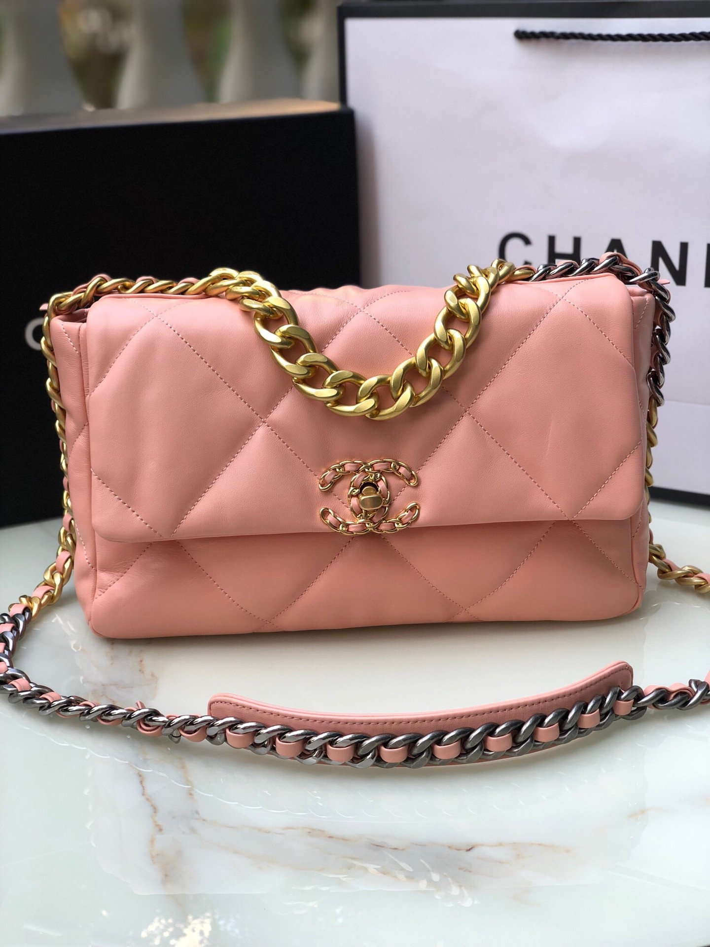 Ch*el 19 large handbag shiny leather, gold-tone, silver-tone & ruthenium-finish metal light pink 7.8 × 11.7 × 3.9 in