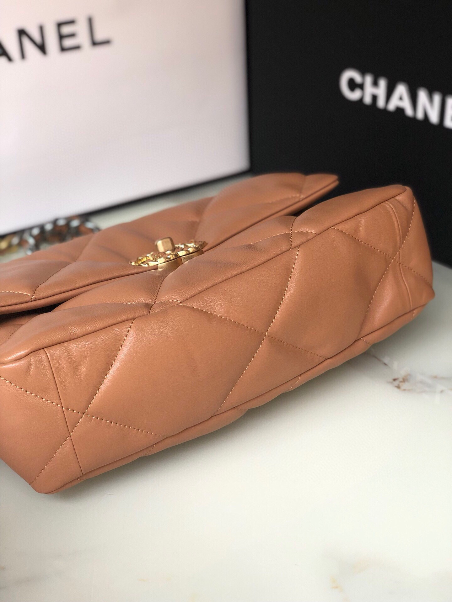 Ch*el 19 large handbag shiny leather, gold-tone, silver-tone & ruthenium-finish metal caramel 7.8 × 11.7 × 3.9 in