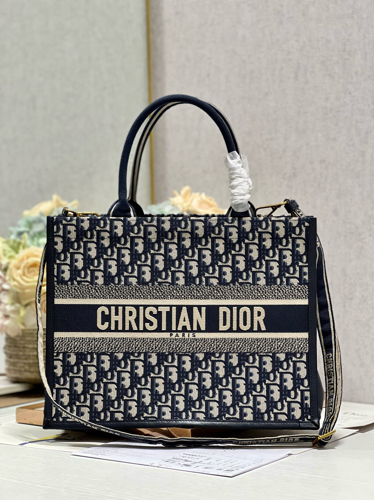 medium D*or book tote ecru and blue D*or oblique embroidery 14 x 11 x 6.5 inches