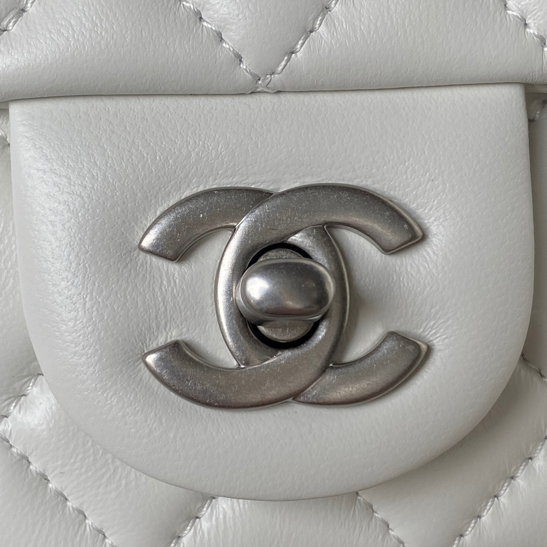 Ch*el mini flap bag shiny calfskin & silver-tone metal white 4.7 × 7.8 × 2.3 in
