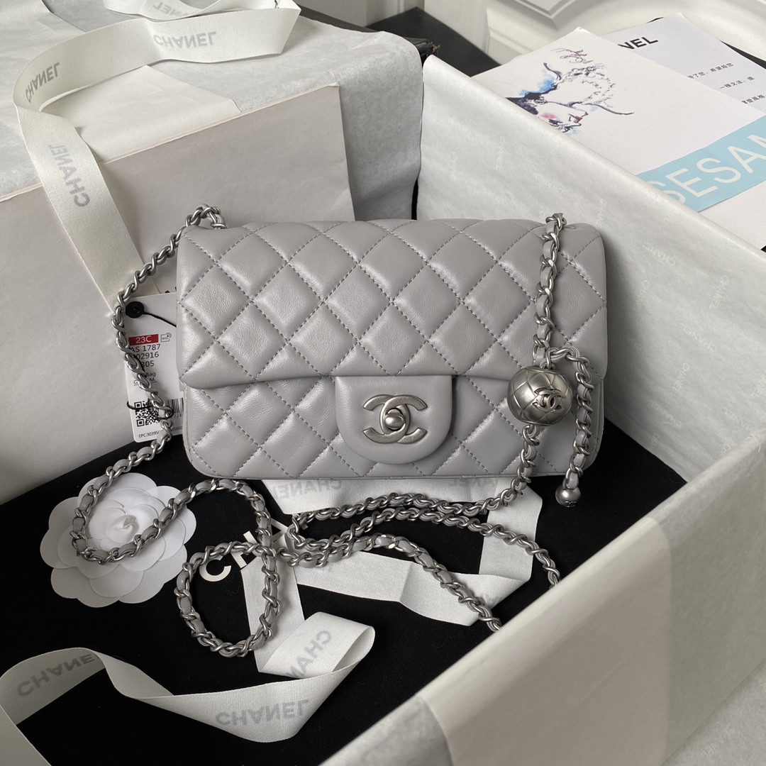 Ch*el mini flap bag shiny calfskin & silver-tone metal light gray 4.7 × 7.8 × 2.3 in