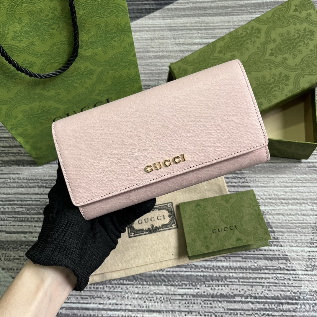 continental wallet with G*u*i script pink 7.5"w x 4"h x 1.4"d