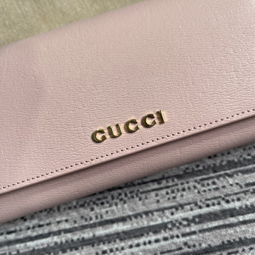 continental wallet with G*u*i script pink 7.5"w x 4"h x 1.4"d