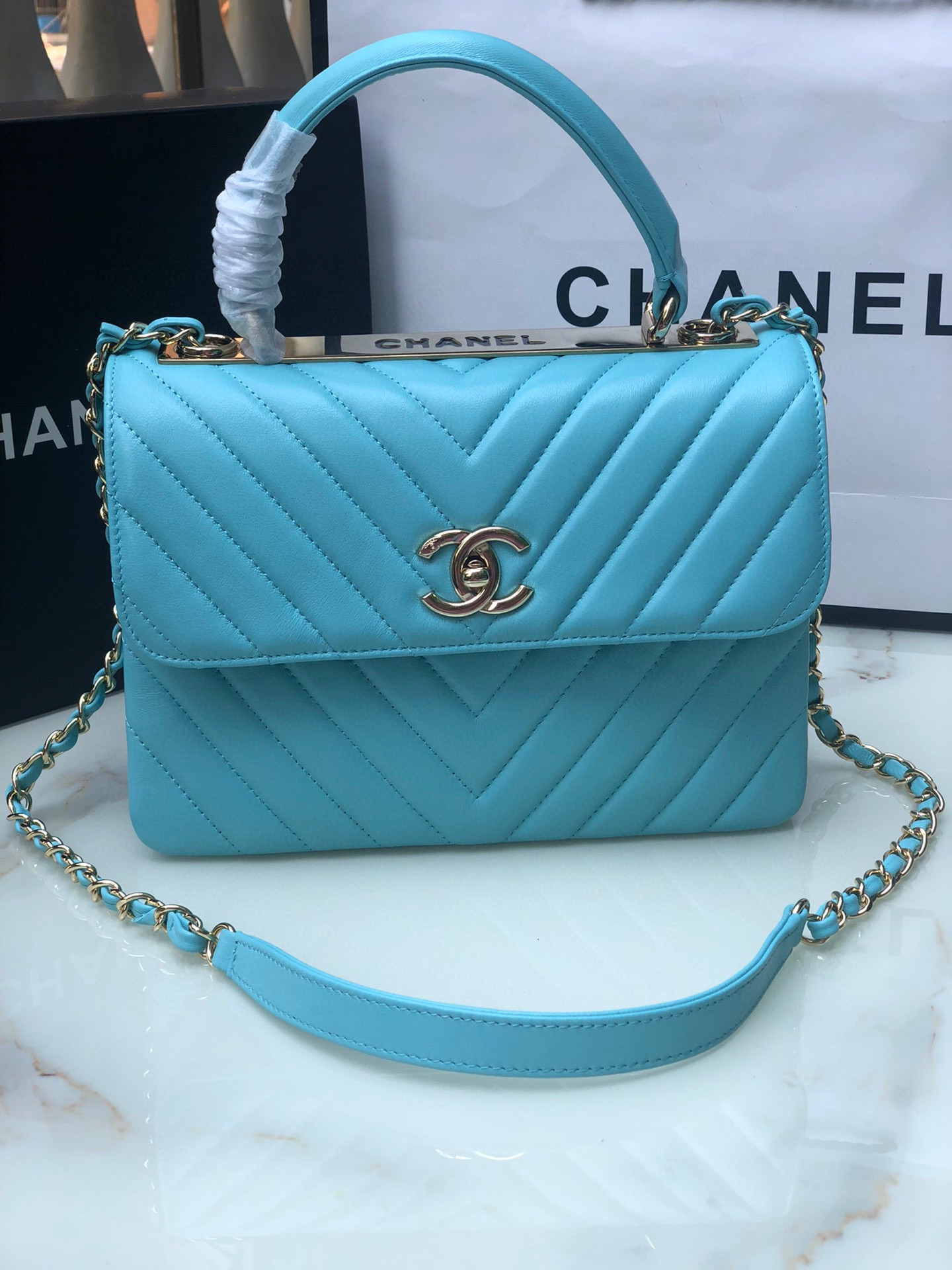 Ch*el flap bag with top handle 6.6 × 9.8 × 4.7 in