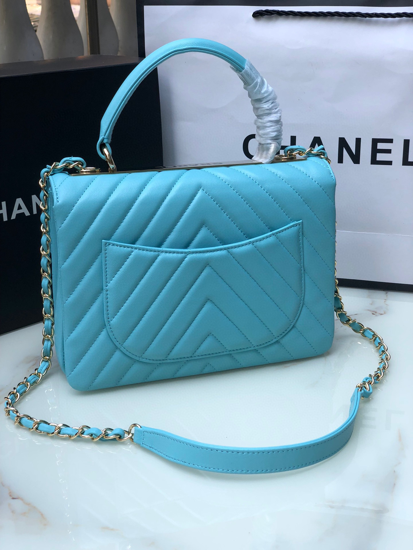 Ch*el flap bag with top handle 6.6 × 9.8 × 4.7 in