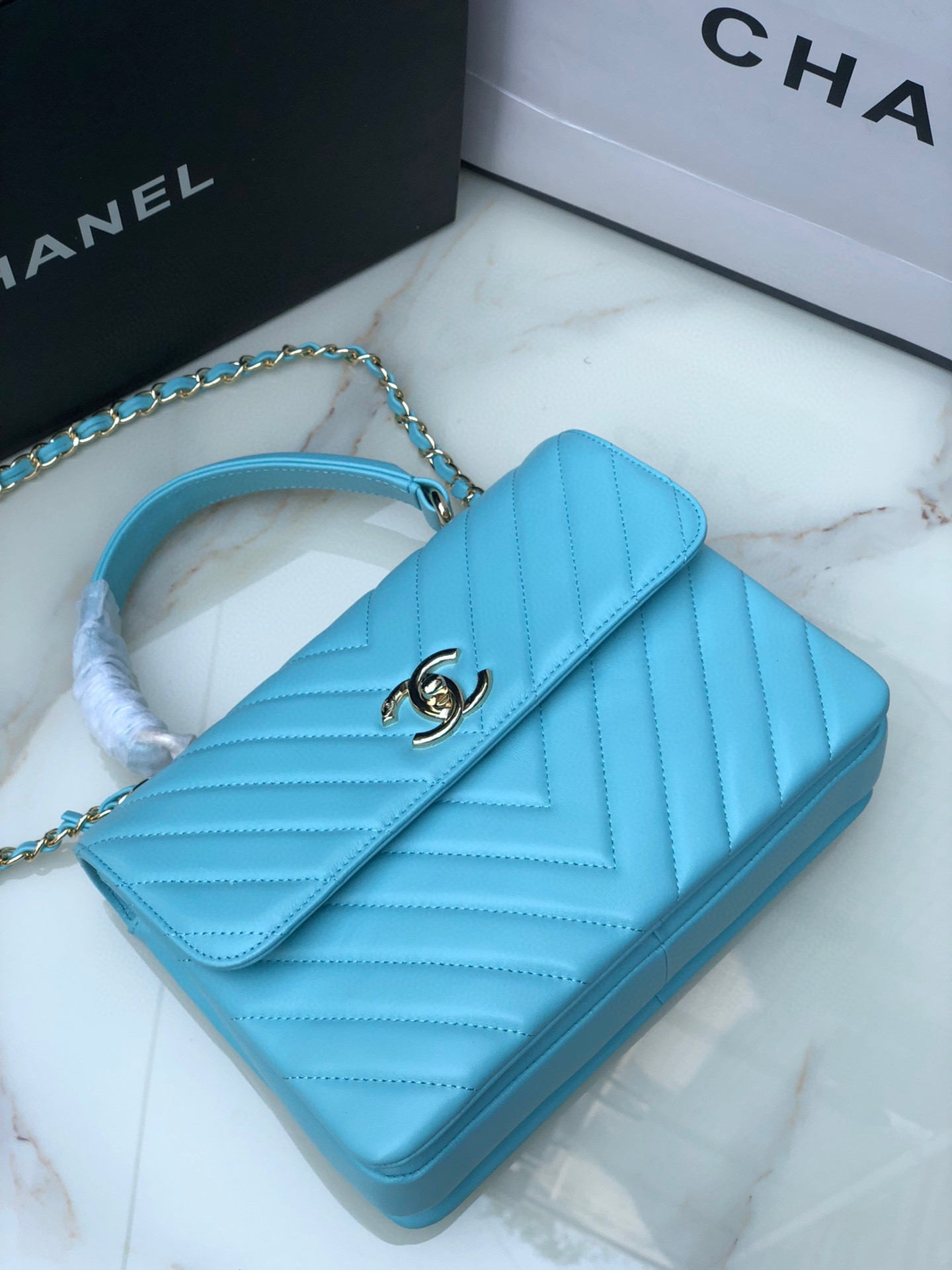 Ch*el flap bag with top handle 6.6 × 9.8 × 4.7 in