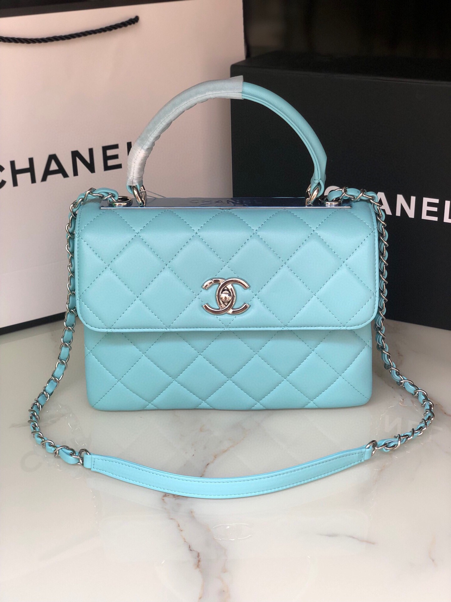 Ch*el flap bag with top handle 6.6 × 9.8 × 4.7 in