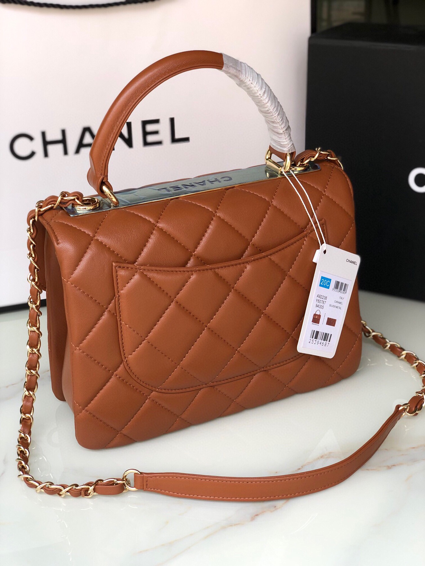 Ch*el flap bag with top handle 6.6 × 9.8 × 4.7 in