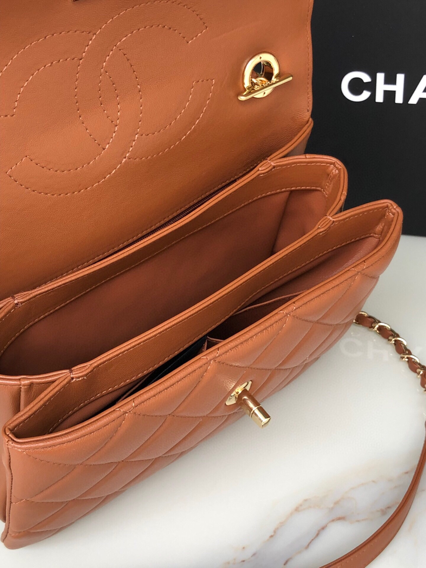 Ch*el flap bag with top handle 6.6 × 9.8 × 4.7 in